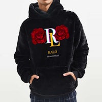 a man wearing a black hoodie with roses on it